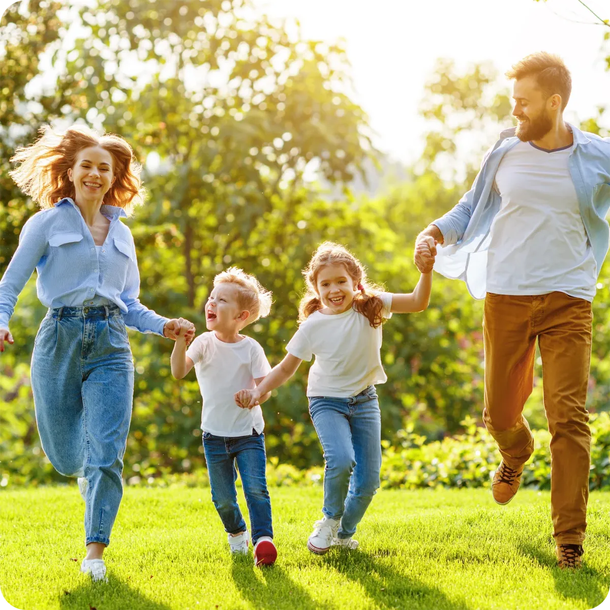 family running and playing outside