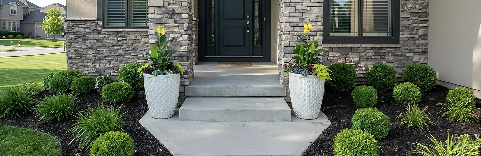 landscaped containers around entryway door