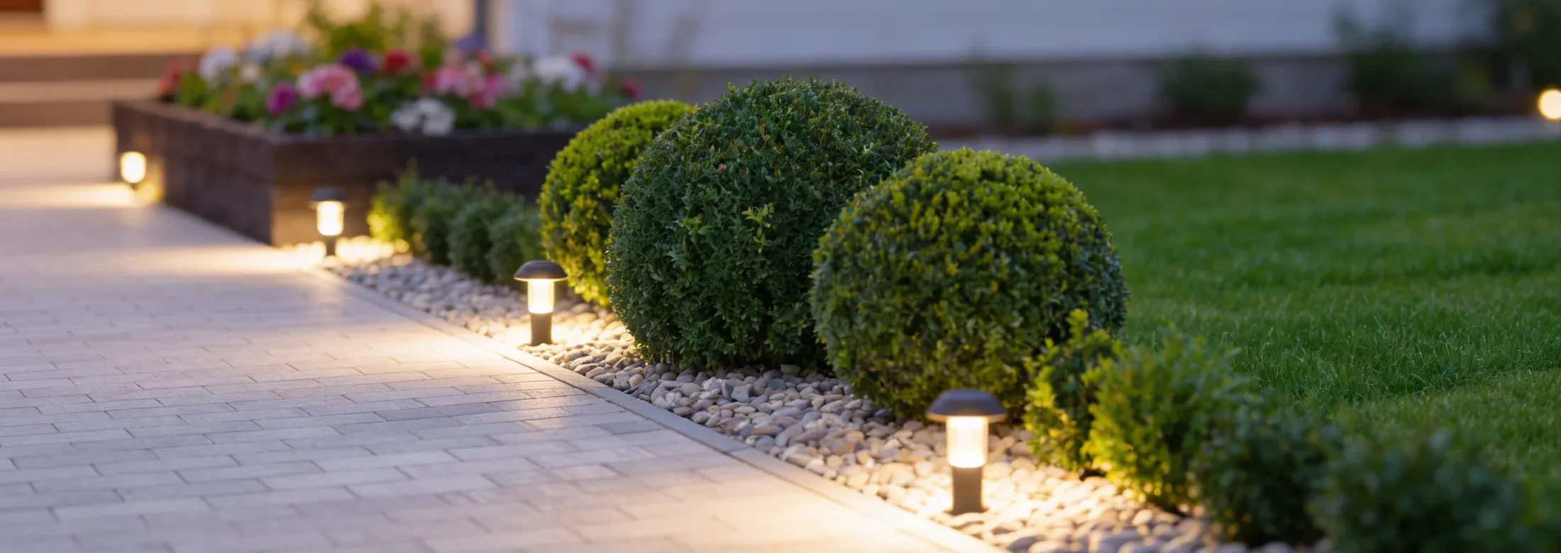 landscape lighting next to a walkway