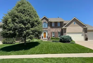 house-with-manicured-lawn