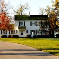 Front of a white house in Autumn