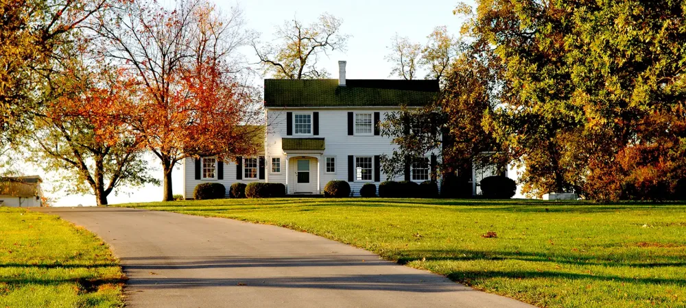 Front of a white house in Autumn